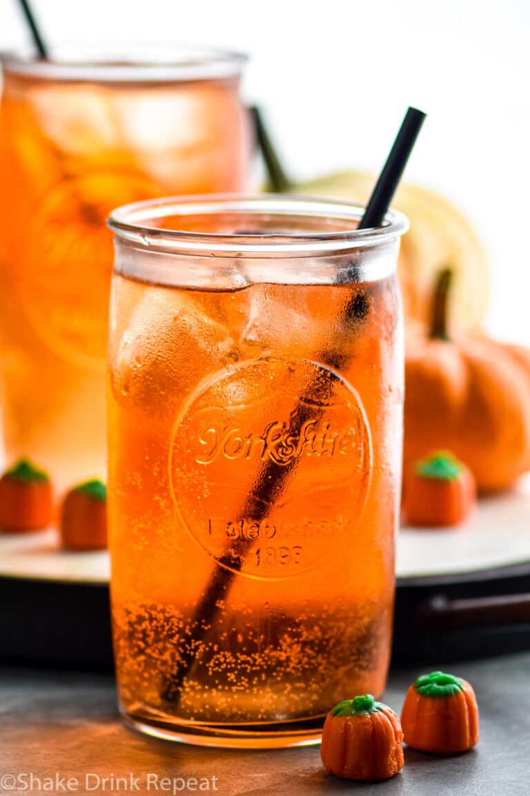 two glasses of Drunk Pumpkin with ice, straw, and pumpkin candies