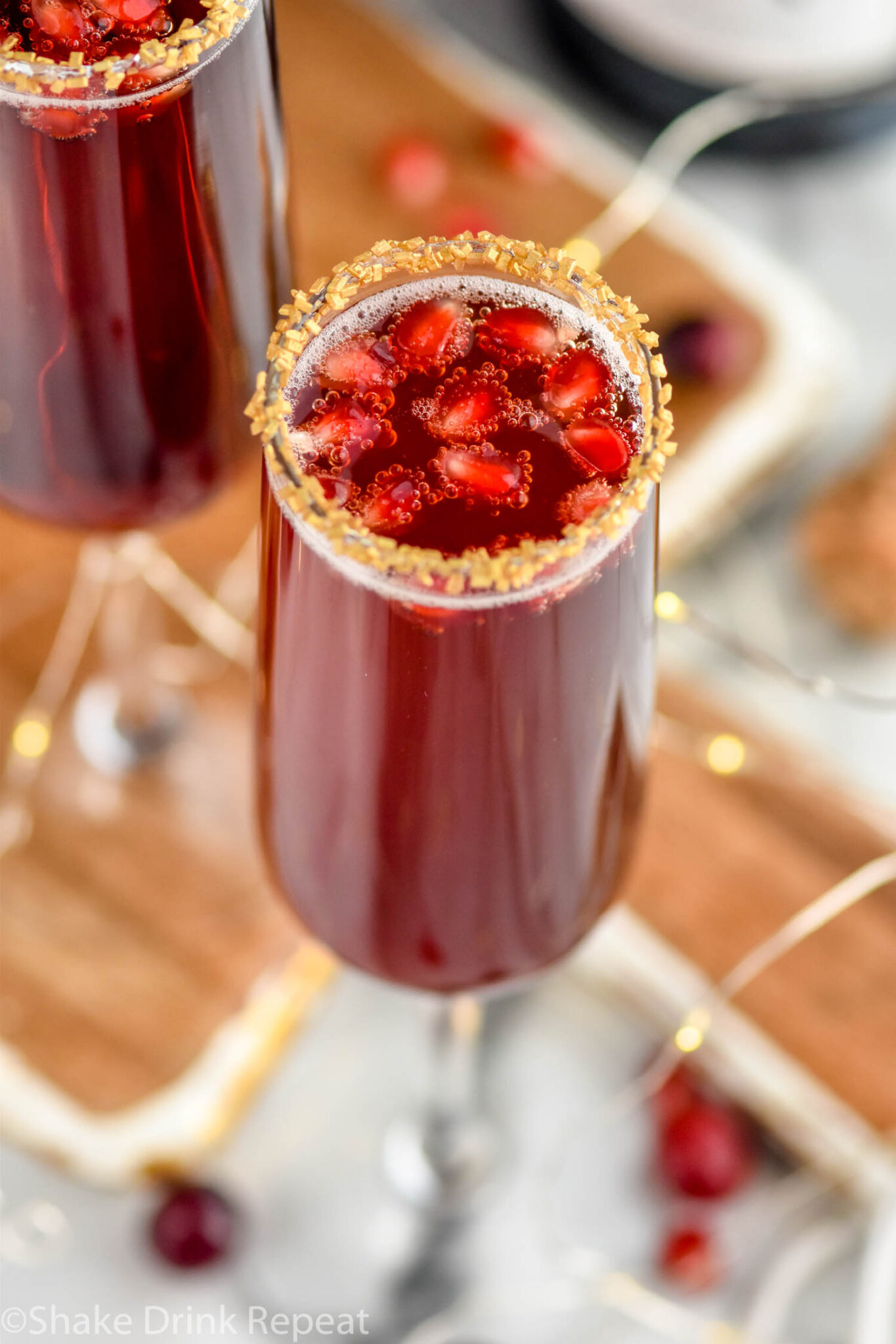 Cranberry Pomegranate Champagne Cocktail - Shake Drink Repeat